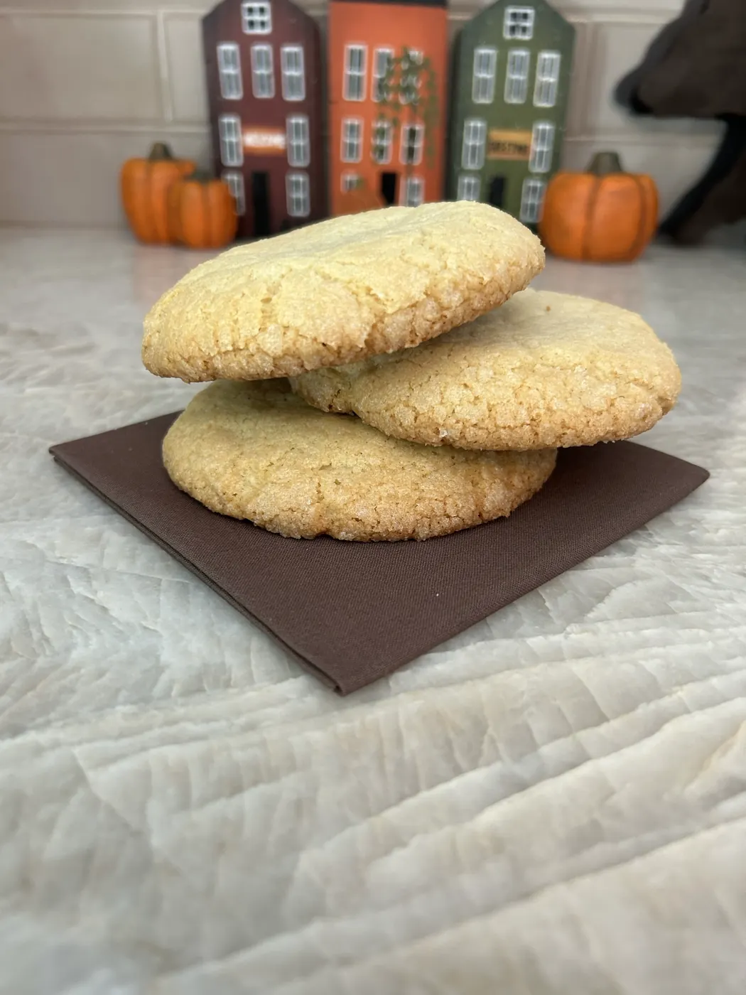 A side view of a thick sugar cookie showing its height